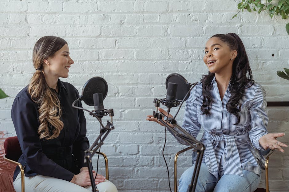 Two people engaged in an animated and positive interview conversation