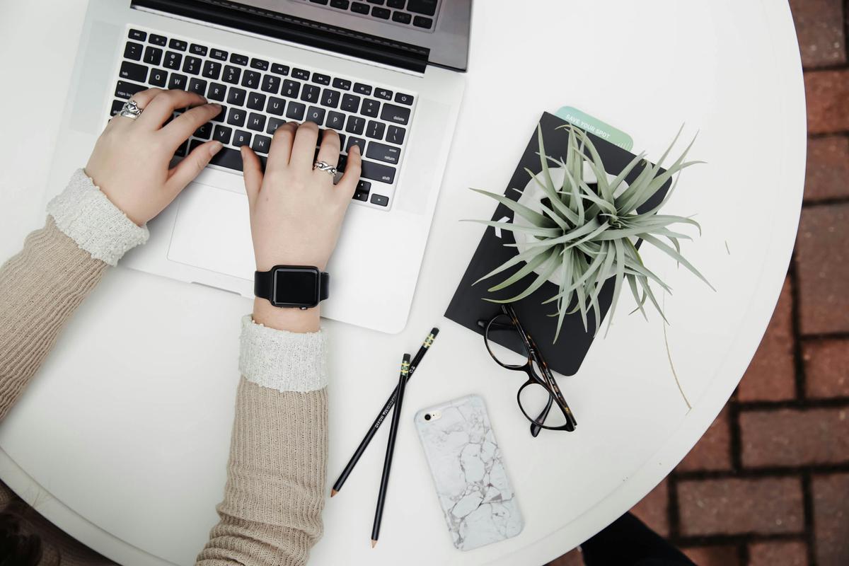 A professional creating an engaging LinkedIn profile on a laptop. Find a job online. 