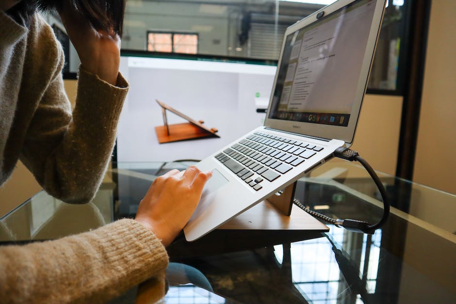 Image depicting a person working on a computer and entering data for an online data entry job.